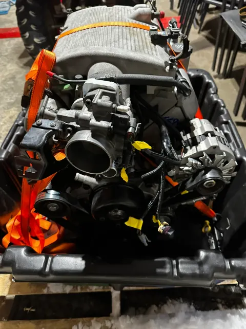 Modern V8 engine strapped in shipping crate