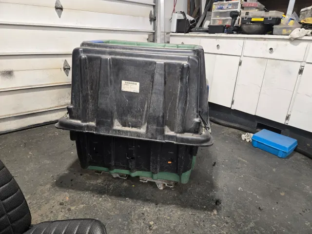 Large plastic storage crate in workshop