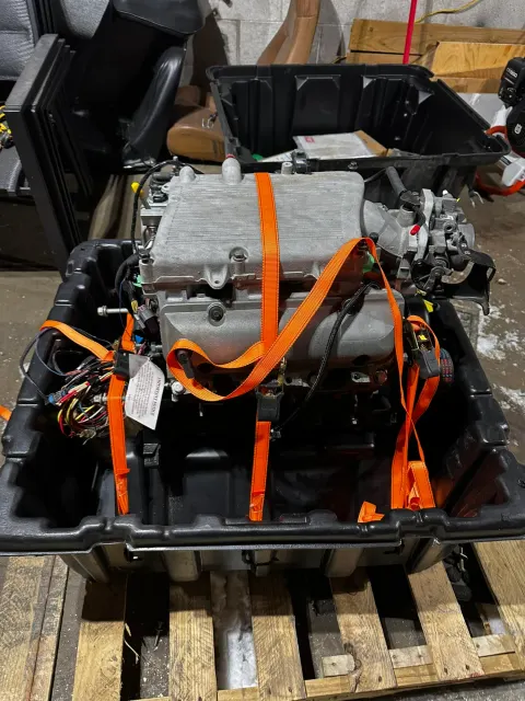 Electric motor and inverter strapped in crate