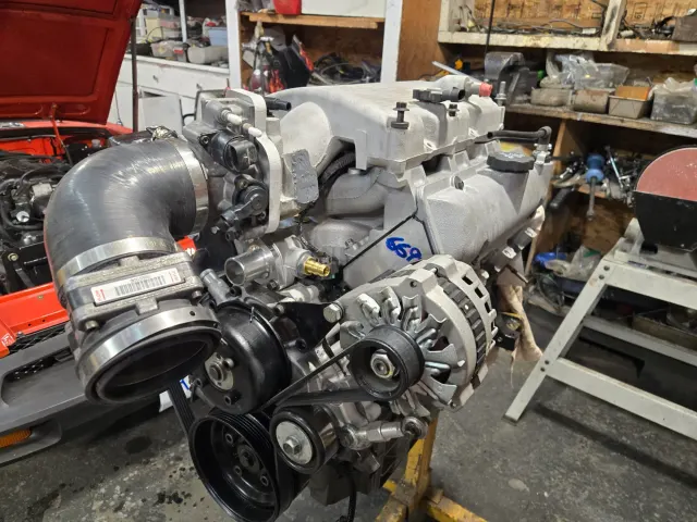 LS V8 engine on stand in workshop