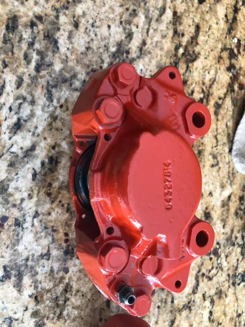 Repainted front brake caliper half