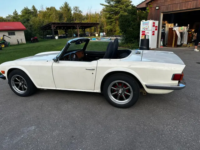 White TR6 side profile with minilite wheels