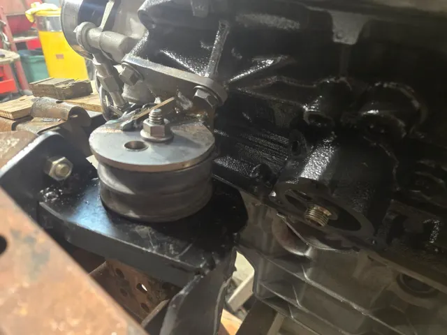 Engine block mounted on stand with mount bracket