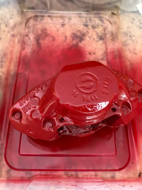 Front brake caliper freshly painted red