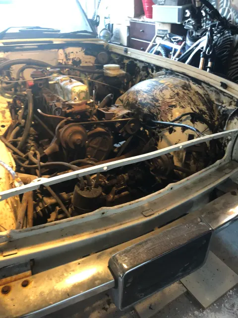 Grimy engine bay with front panels removed