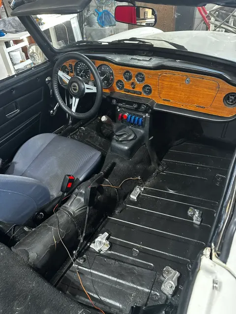 Stripped TR6 interior with wood dash refitted