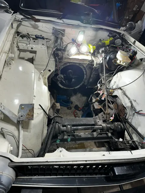 Empty engine bay with brake servo and wiring