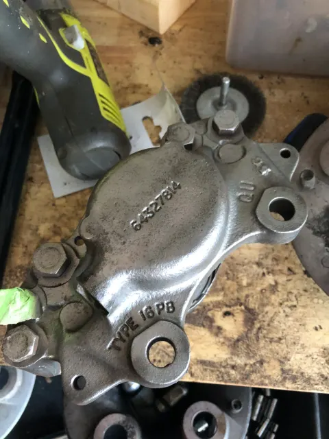 Cleaned steering box casing showing part number 64327814