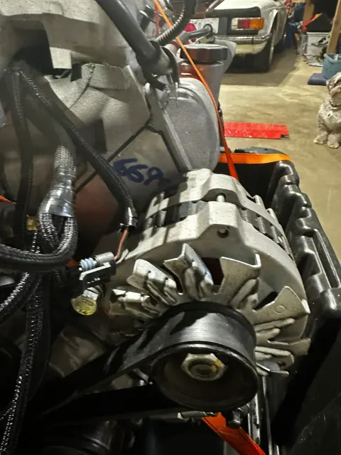 Alternator mounted on engine with wiring