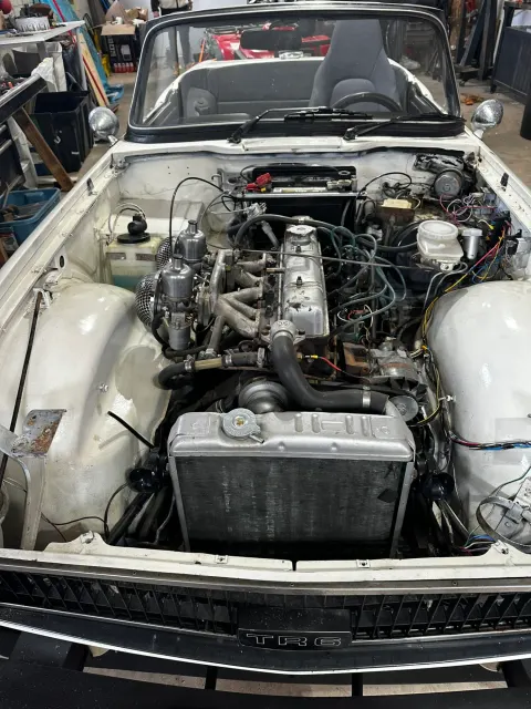 TR6 engine bay with straight-six installed