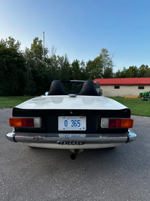 Rear view of white TR6 with Ontario plate