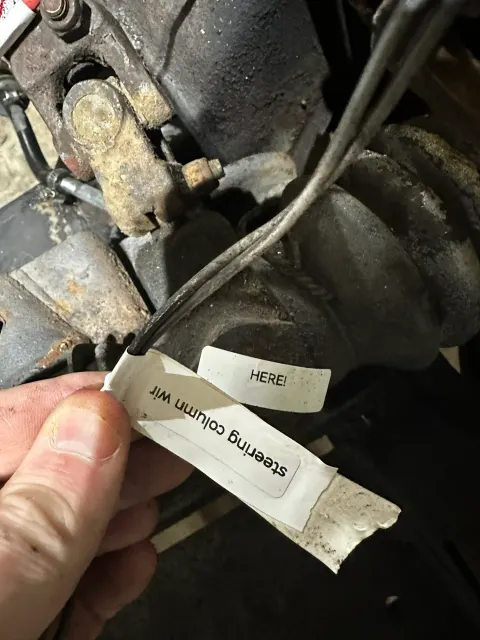 Labelled steering column wiring loom during teardown