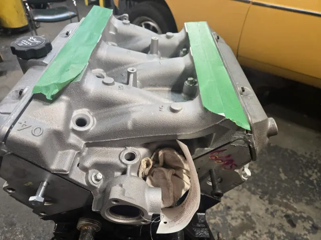 Freshly blasted engine block with masked surfaces