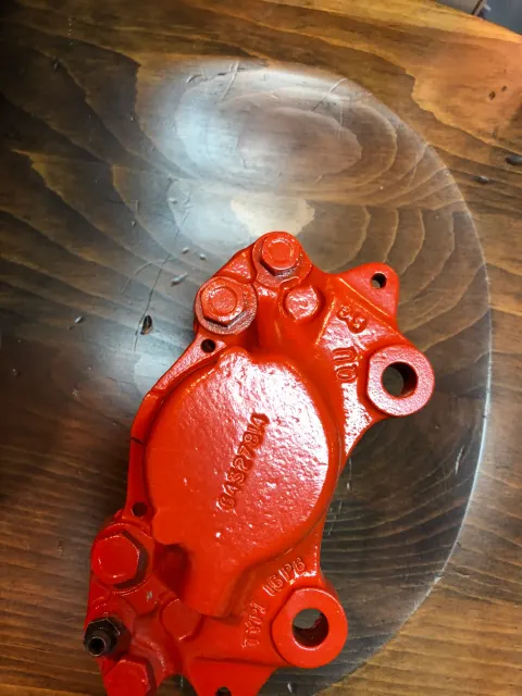 Repainted front brake caliper half in red