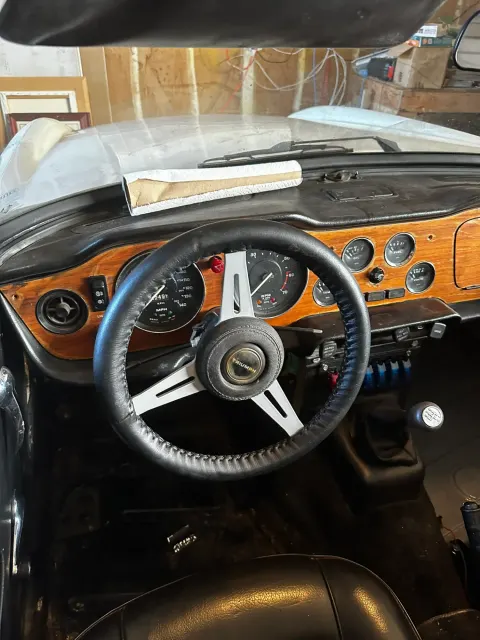 TR6 dashboard and wood-rim steering wheel from driver's seat