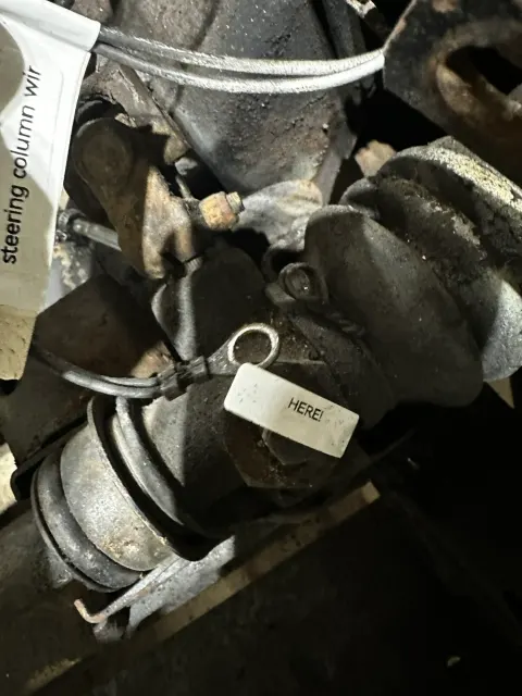 Steering column wiring routing marked with labels