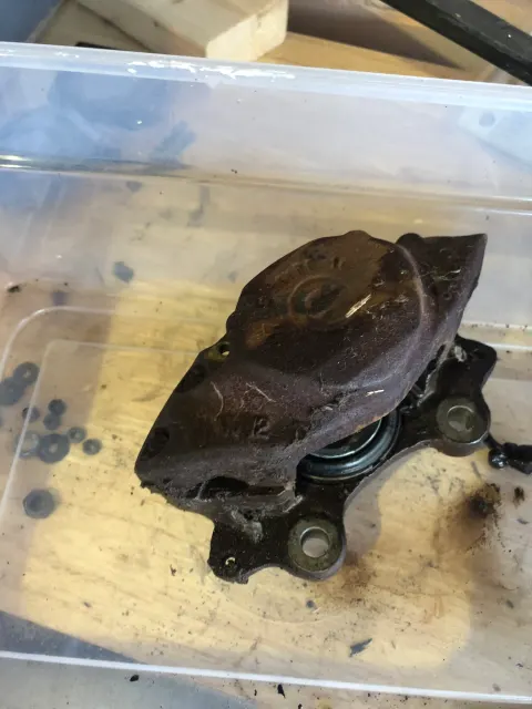 Rusty brake caliper removed and boxed