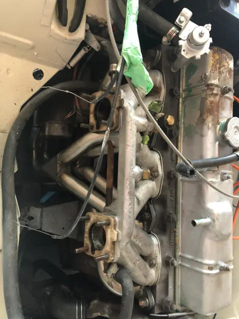 Inline-six engine bay with intake and exhaust manifolds
