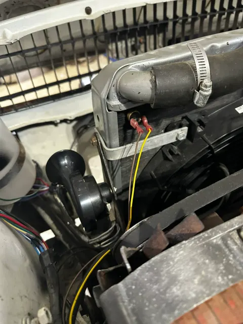 Horn and wiring behind front grille
