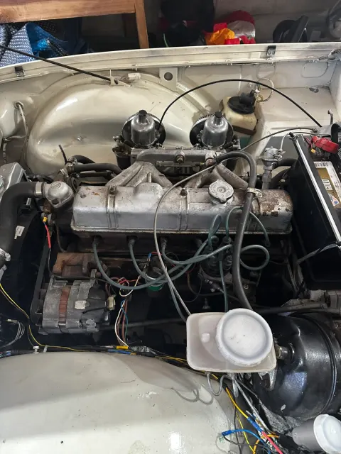 Twin-carb Triumph engine bay before work