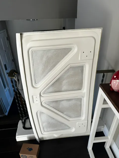 White painted panel with pressed triangular sections indoors