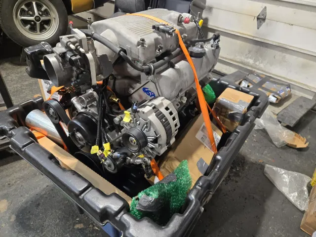 Modern V8 crate engine strapped to shipping pallet