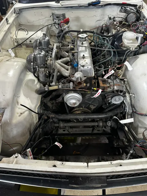 Straight-six engine in stripped engine bay