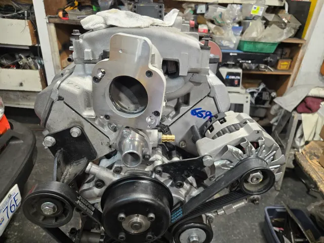Rebuilt V6 engine on stand in workshop
