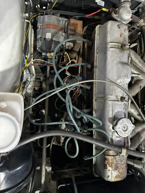 Engine bay wiring loom and radiator cap