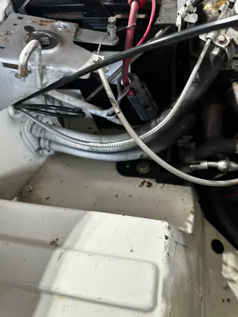 Braided hoses and cables in engine bay corner