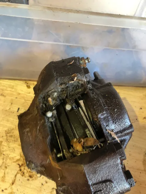Corroded front brake caliper before overhaul