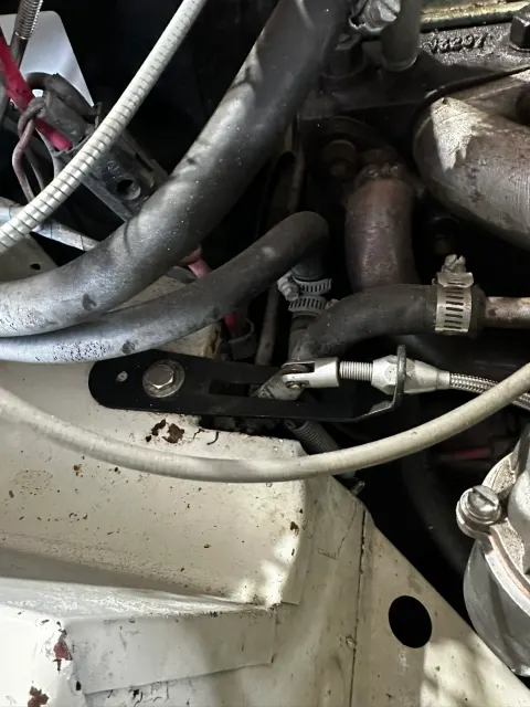Throttle cable linkage attached to bellcrank