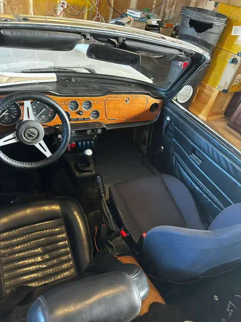 Unrestored TR6 cockpit with wood dash