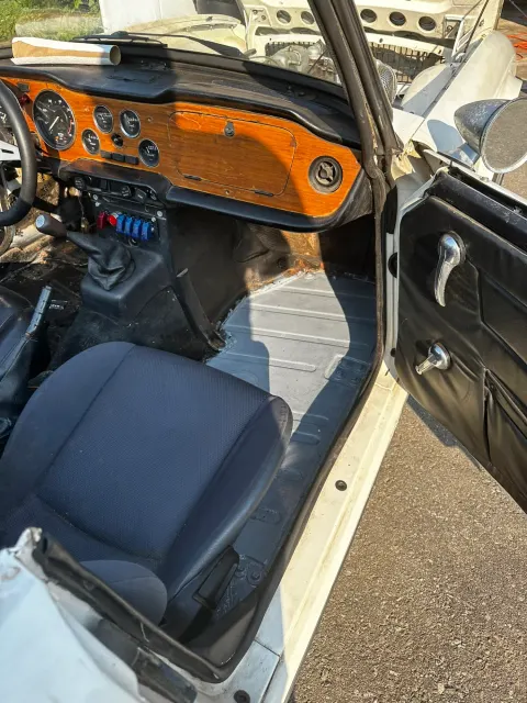 Cockpit interior with wood dash and open door
