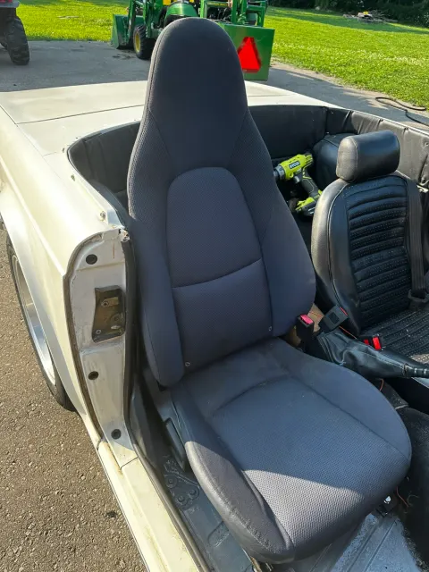 Mazda Miata seat trial-fitted in TR6 cockpit