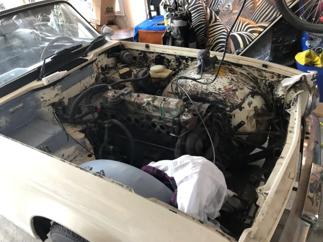 Inline six engine bay awaiting restoration