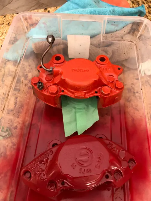 Freshly painted red brake calipers drying