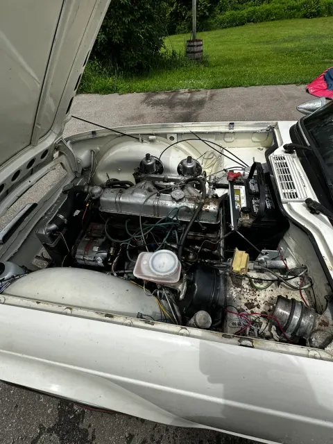 Engine bay of classic car with bonnet open