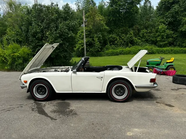 White TR6 side profile with bonnet and boot open