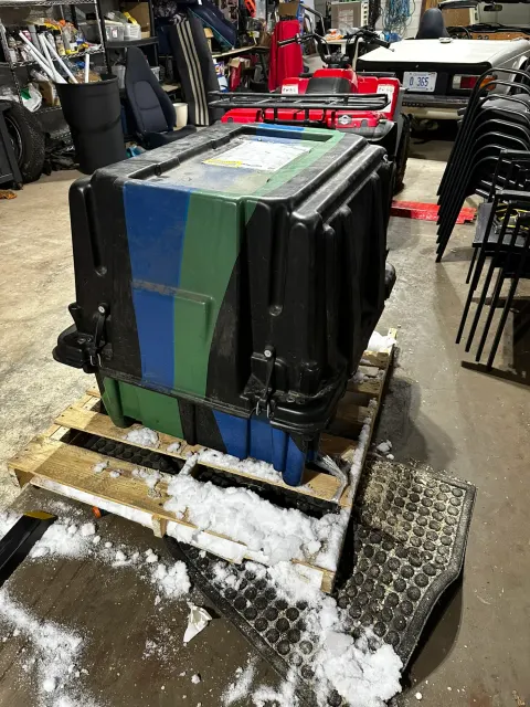 Large shipping crate on pallet in workshop