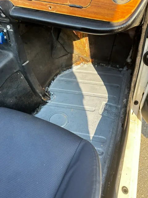 Passenger footwell with carpets removed