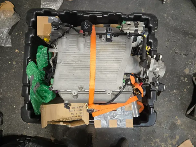 Modern electric drive unit strapped in crate