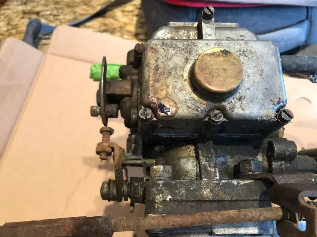 Dismantled Stromberg carburettor body on workbench